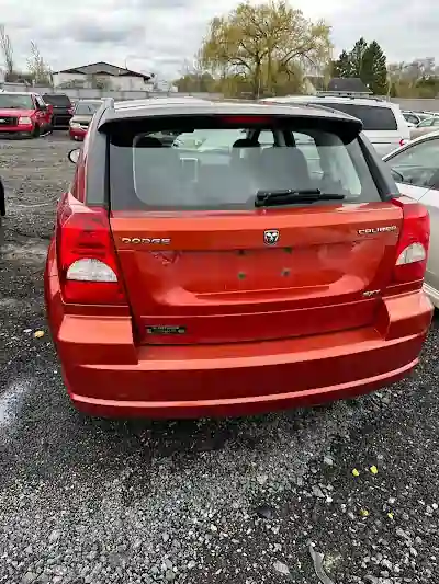 Orange Dodge Caliber junk car removal in North York, Toronto